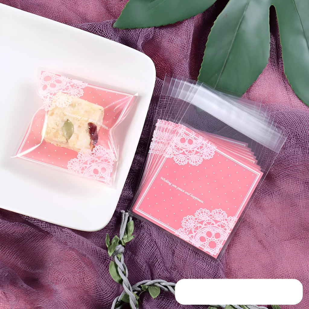 Pink self-adhesive plastic packaging bags, 7cm by 7cm with gusset, pack of 100.