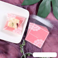 Pink self-adhesive plastic packaging bags, 7cm by 7cm with gusset, pack of 100.