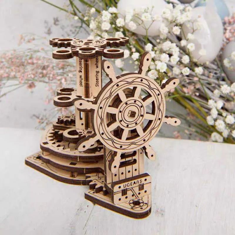Ukrainian wooden rotating pen holder model with visible gears on a desk.