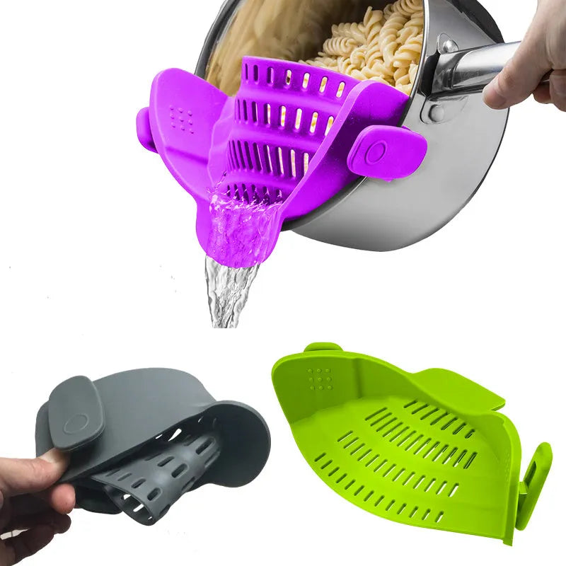 Silicone clip-on kitchen strainer attached to pot rim draining liquid