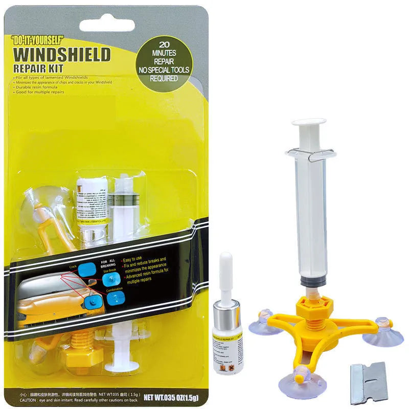 Yellow auto glass repair tool with triangle bracket and 2ML repair fluid on a car windshield