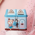 Blue house-shaped tinplate piggy bank on desktop with coin slot
