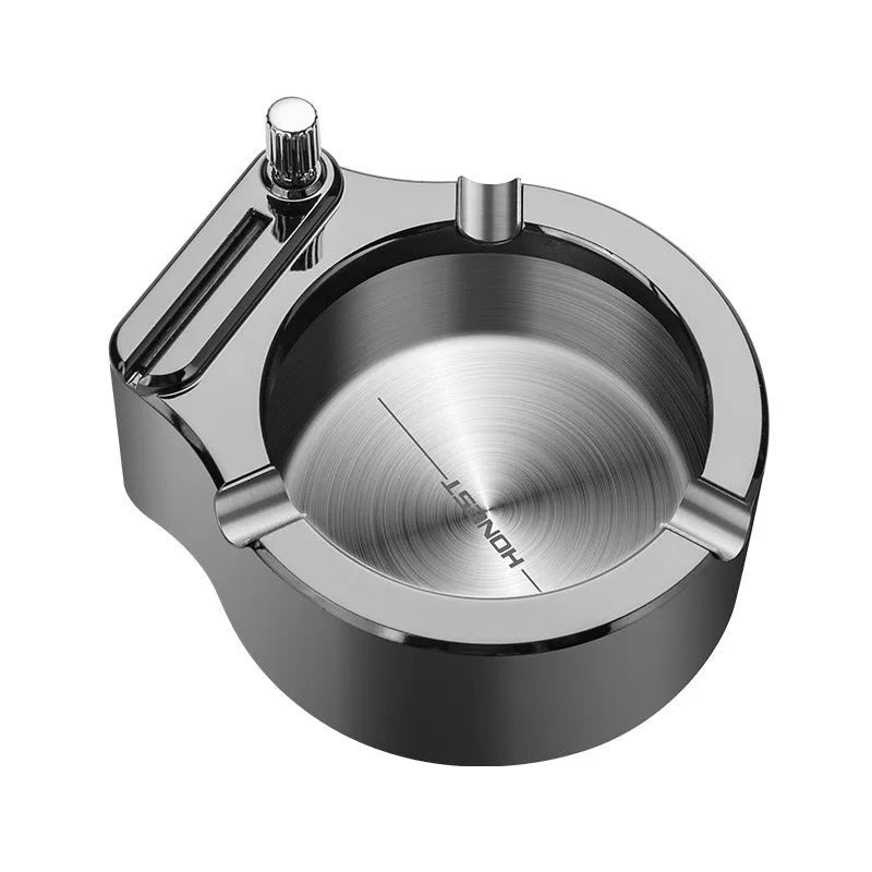 Large brushed stainless steel ashtray with sliding permanent match lighter and three cigarette slots in gold colour