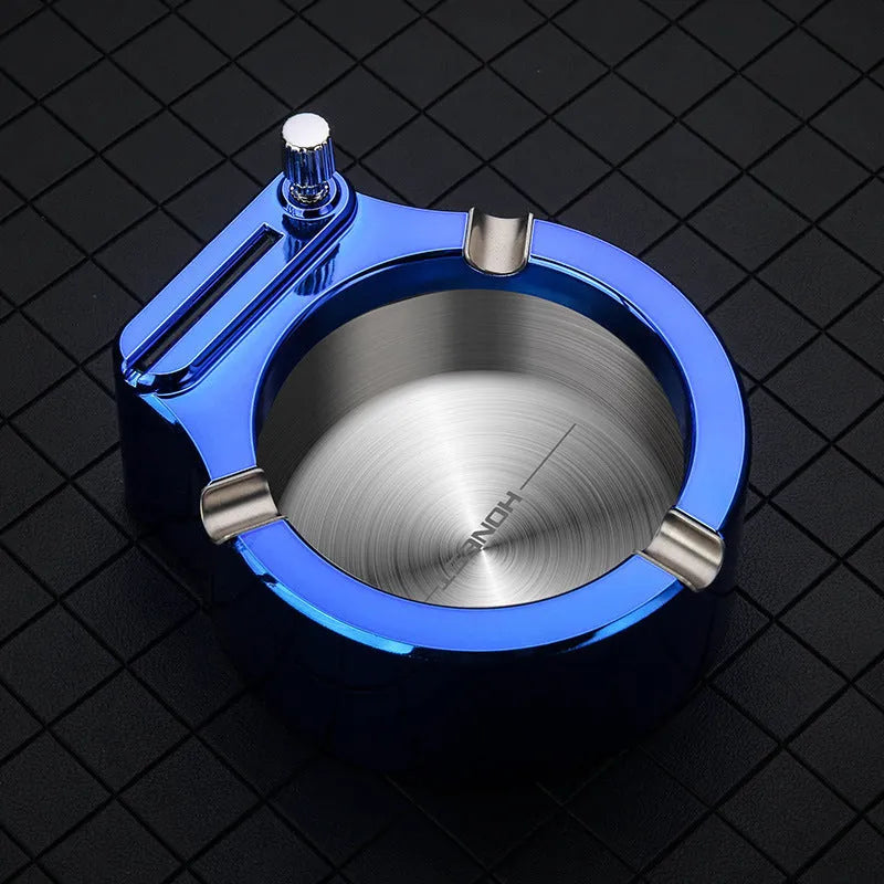 Large brushed stainless steel ashtray with sliding permanent match lighter and three cigarette slots in gold colour