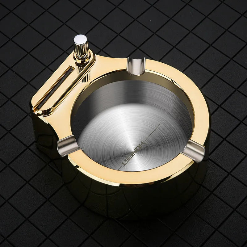 Large brushed stainless steel ashtray with sliding permanent match lighter and three cigarette slots in gold colour