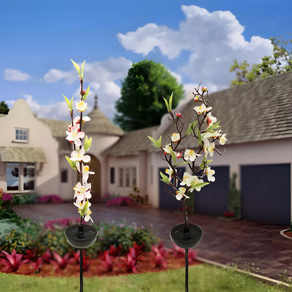 Solar-powered cherry blossom firework string light with ground stake for outdoor garden.