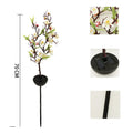Solar-powered cherry blossom firework string light with ground stake for outdoor garden.