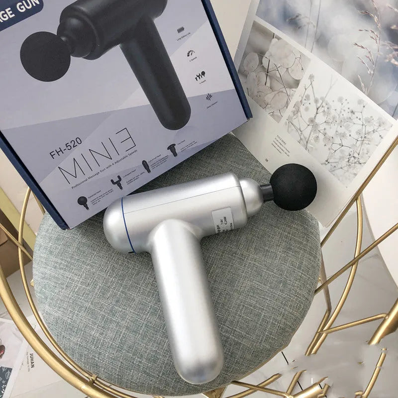 Cordless fascia massage gun with USB charging port in grey, red, or black colour options