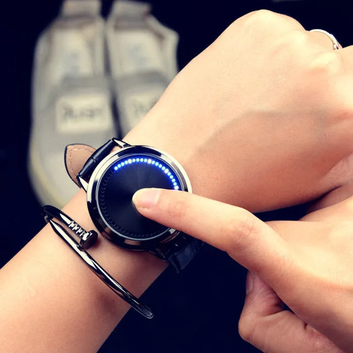 Electronic digital watch with blue light display showing numbers, available in black and white colours
