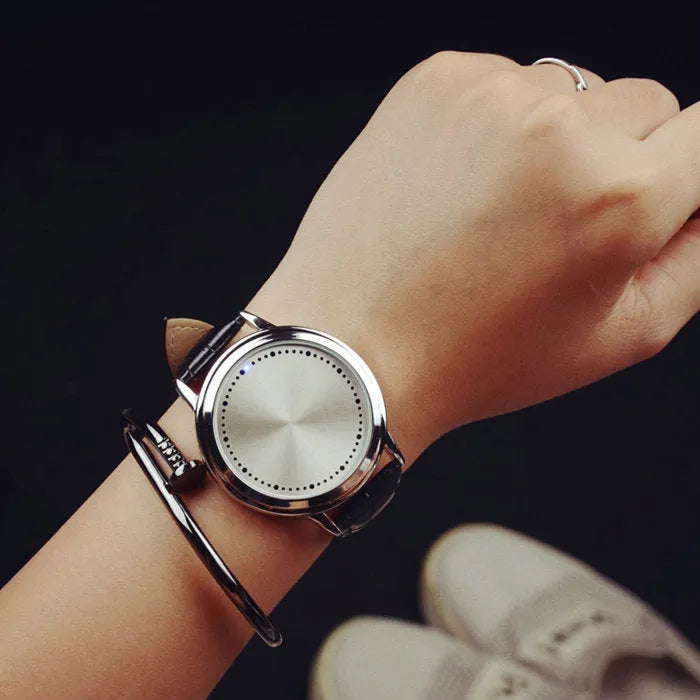 Electronic digital watch with blue light display showing numbers, available in black and white colours