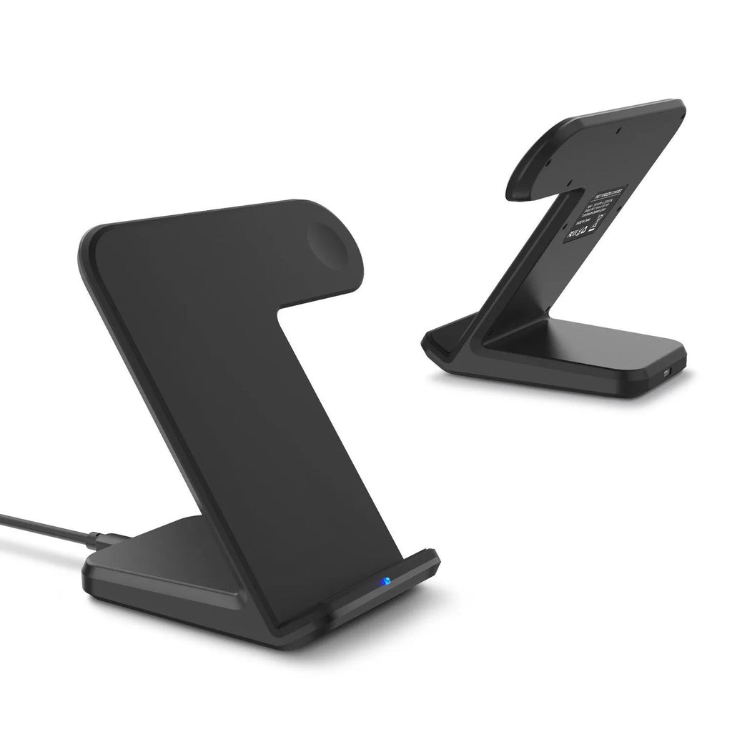 Black wireless charging pad on a wooden desk with smartphone placed on top, showing non-slip silicone base.