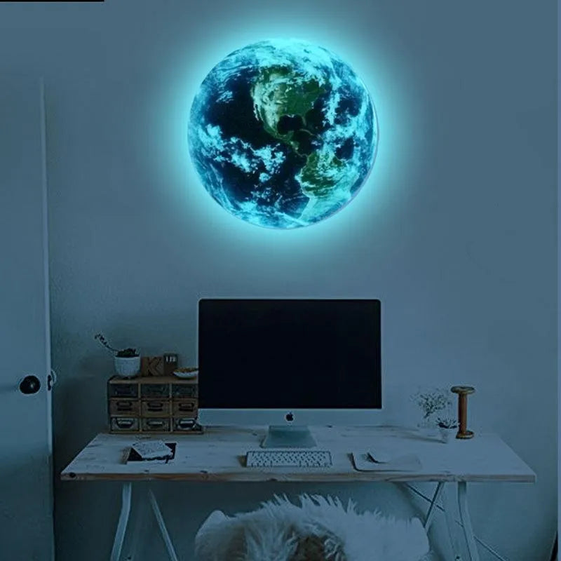 Glow in the dark 3D Earth planet wall sticker in multiple sizes on a dark wall.