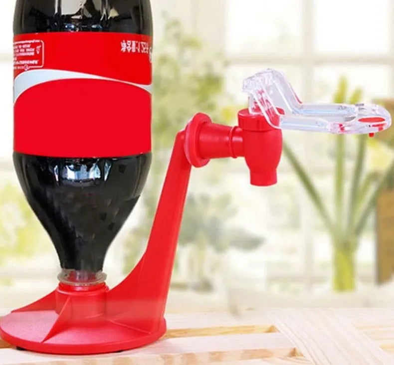 Red plastic Magic Tap soda bottle dispenser attached to an inverted 2-litre bottle.