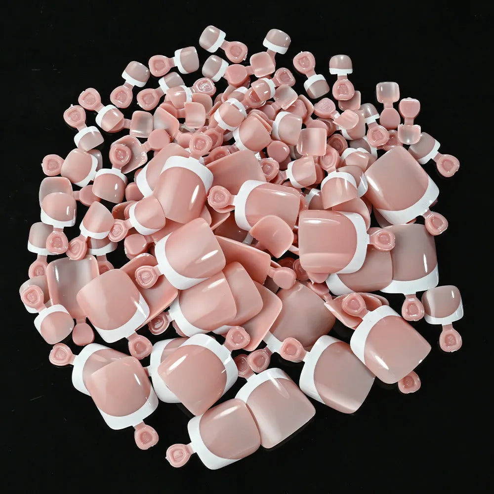 120 piece box of French white edge nude artificial toenails in nine shades, square short shape for toes.