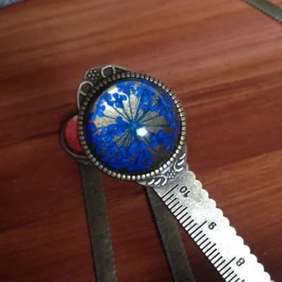 Handmade dried gypsophila flower bookmark ruler showing lace flowers, daffodils, and clovers on 12cm length