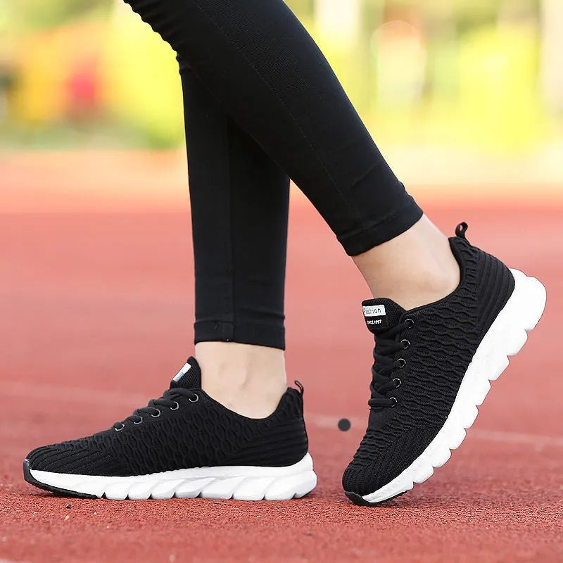 Women's running shoes with fly weaving upper in black, pink, or white colour options