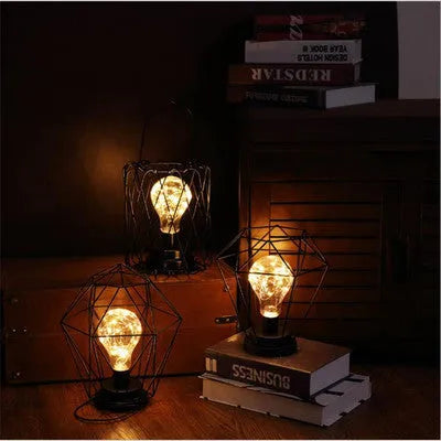 Minimalist hollow iron table lamp with warm white LED light in red wine bottle style