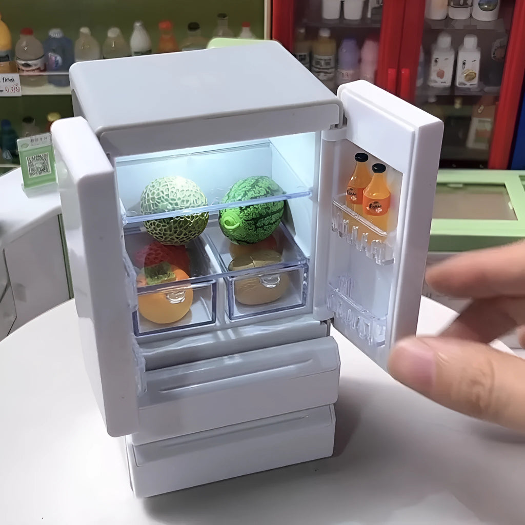 White plastic miniature candy shop toy model with LED light-up feature on display