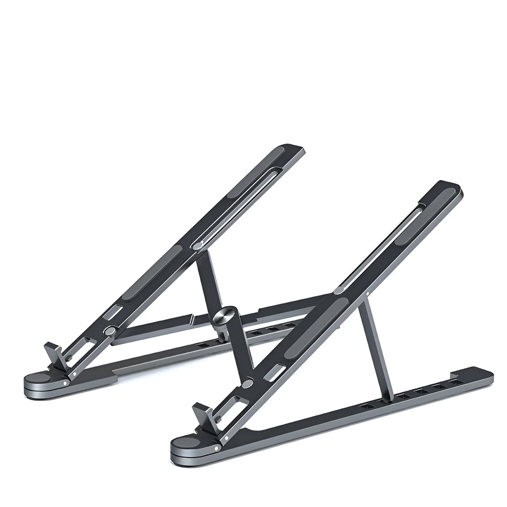 Aluminium foldable laptop stand in silver colour set to medium height with a laptop on top.