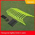 Set of six bright green, orange, and yellow foldable hexagon football agility training rings laid out on grass.