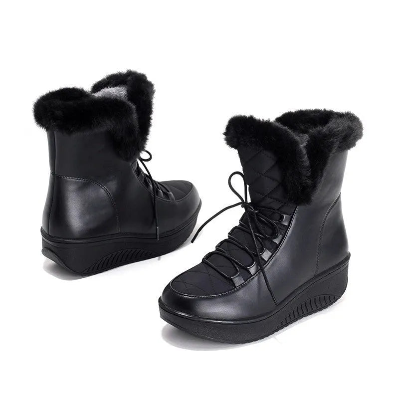 Black women's lace-up winter boots with a platform sole on a white background