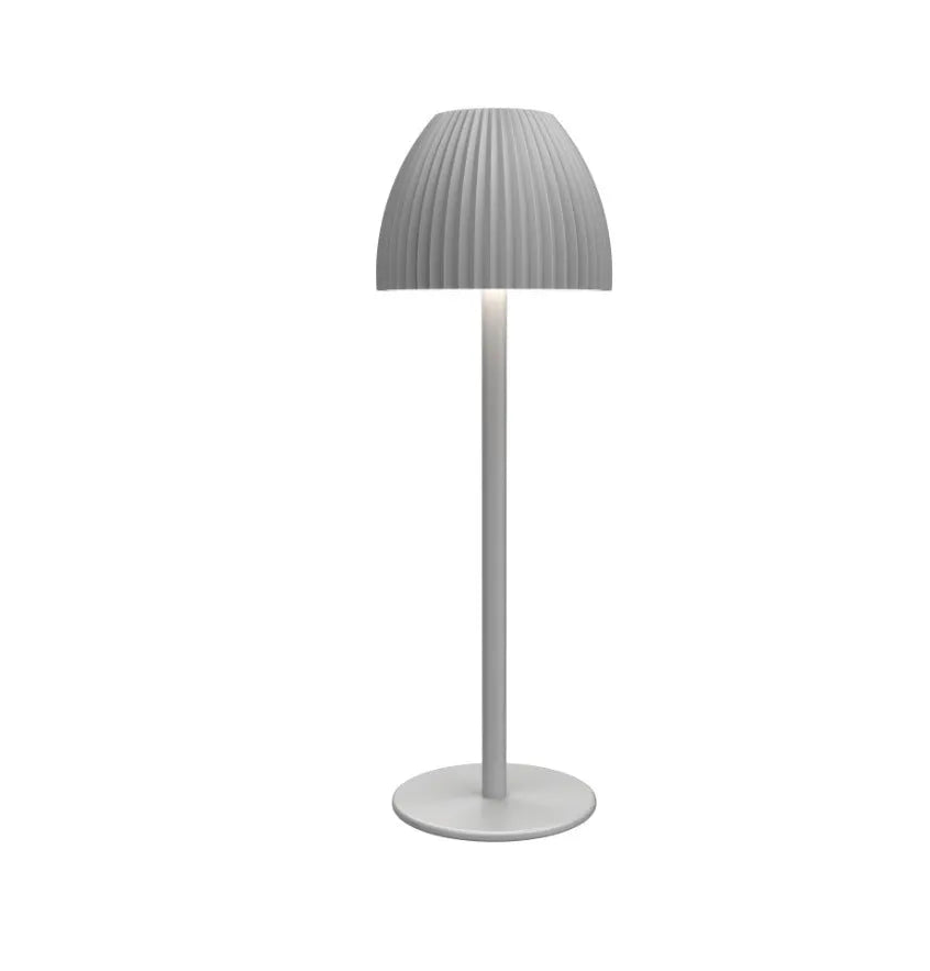 Ins pattern dimmable night lamp with thin round base in black or white, placed on a bedside table.