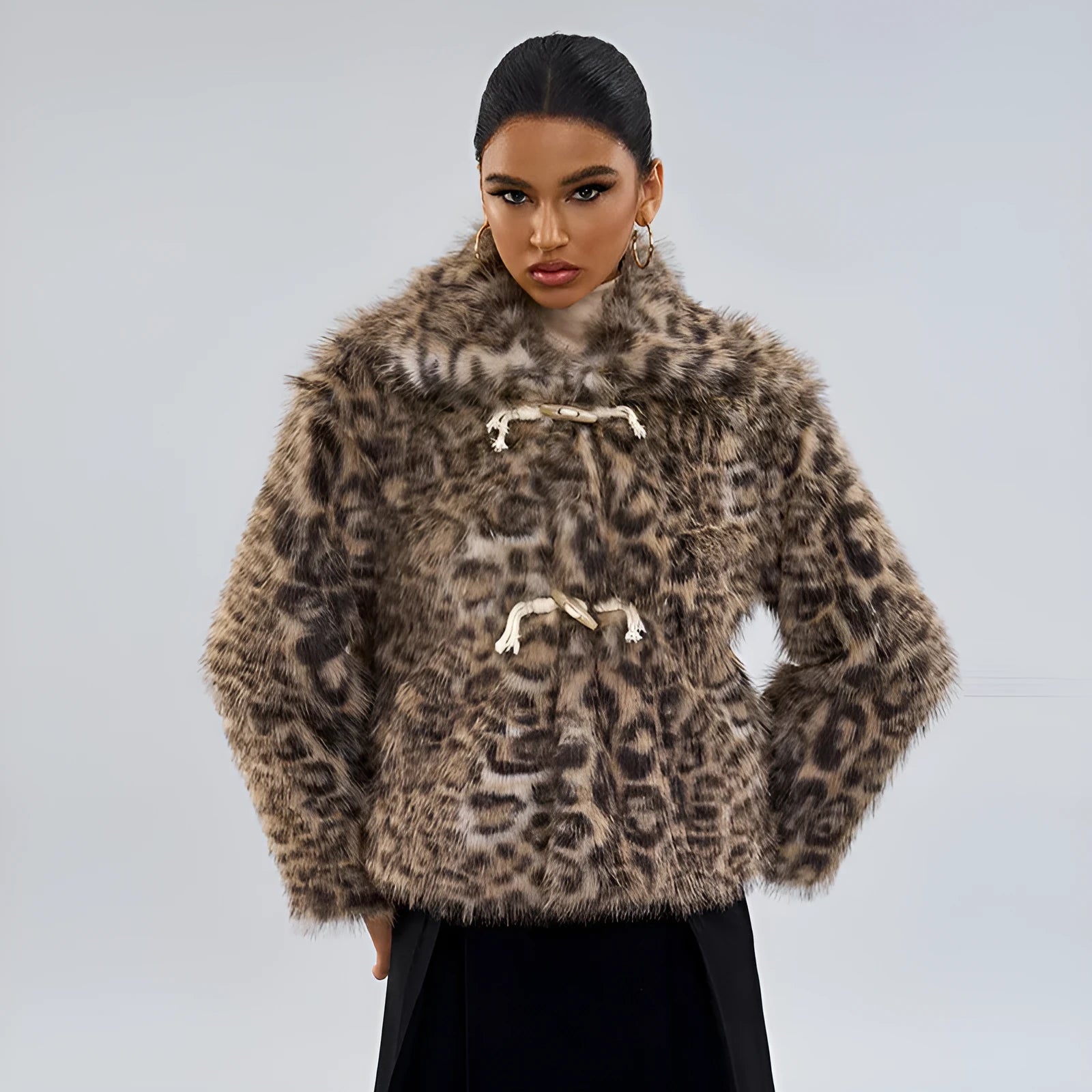 Women's leopard print coat with a buckle lapel and regular sleeves.