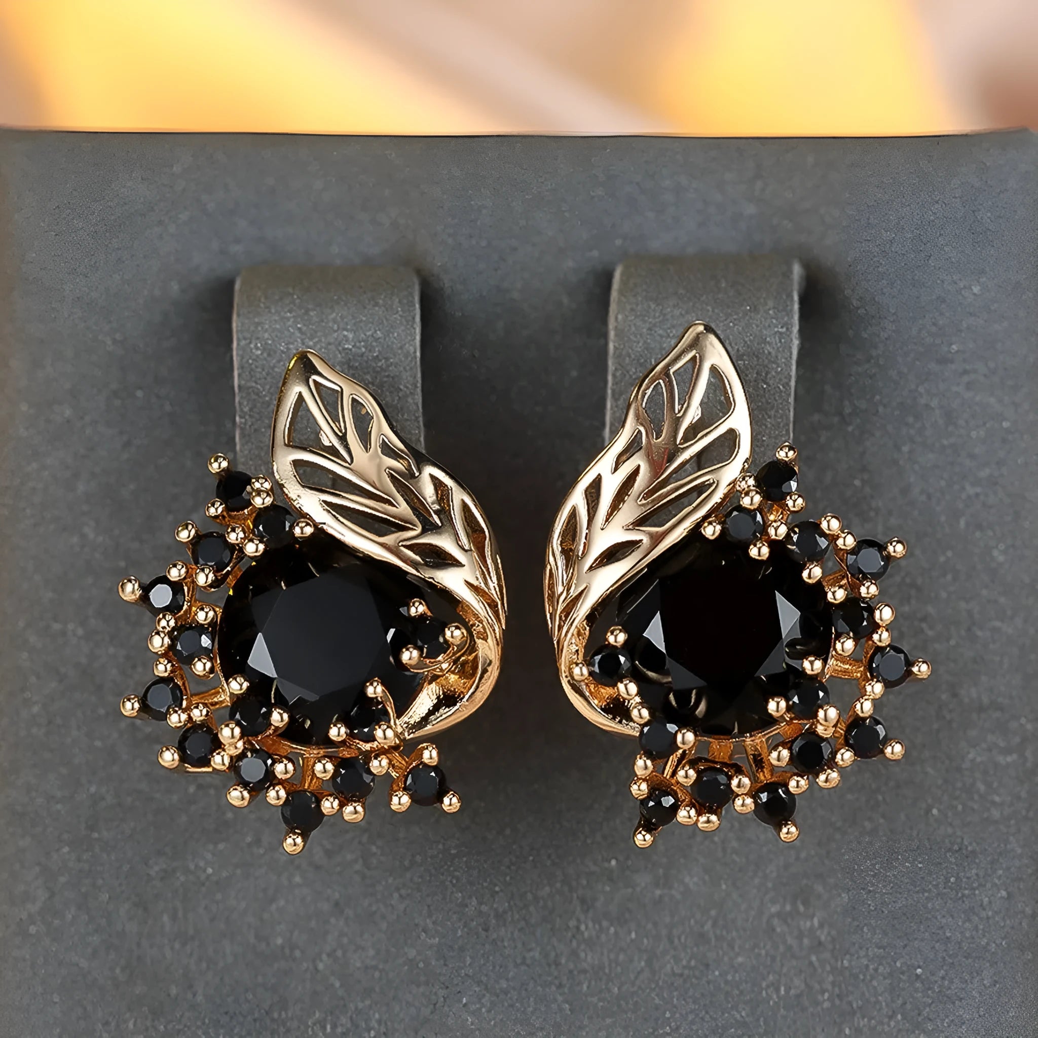 Round flower feather design earrings with champagne gold setting and coloured zircon stones.