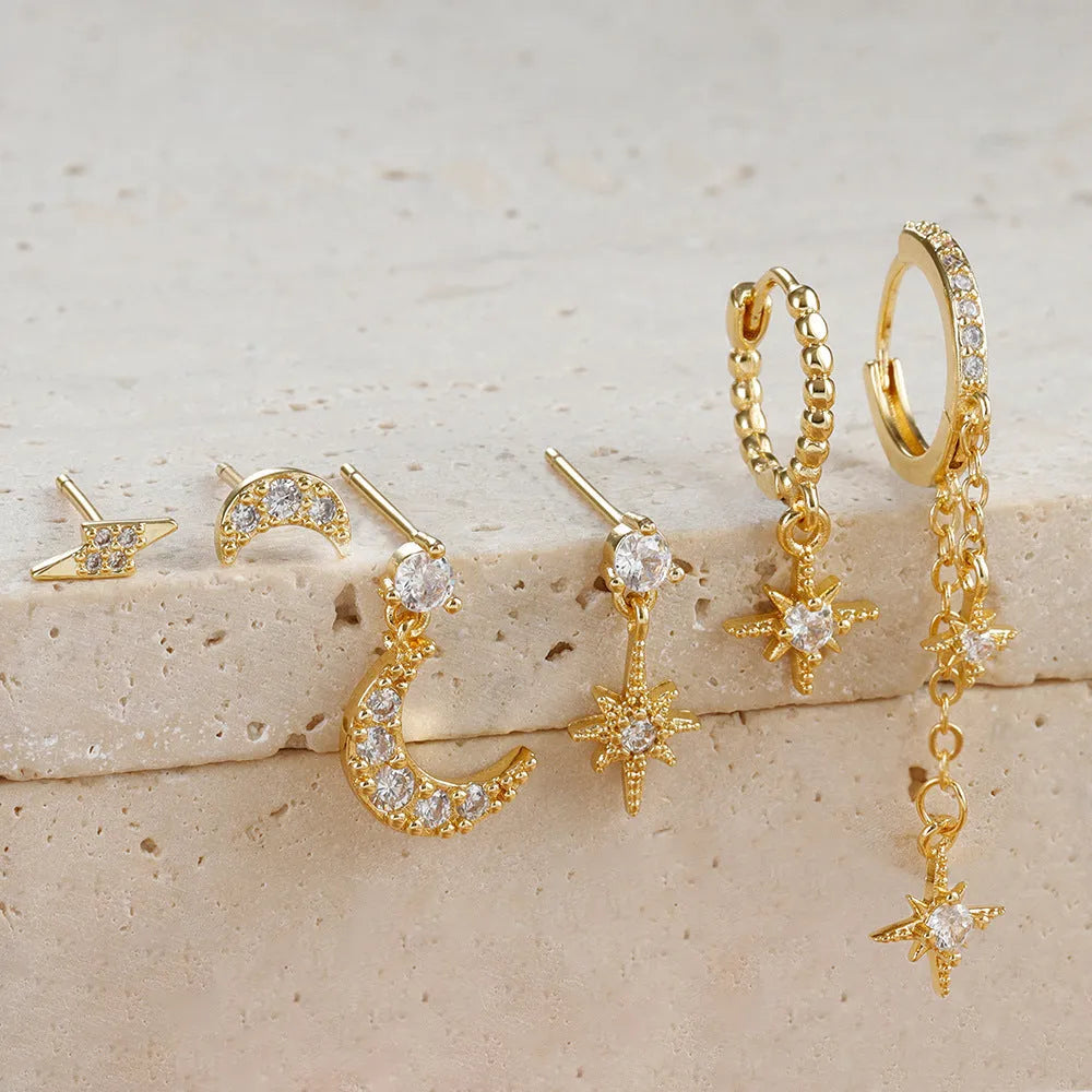 Six pairs of gold electroplated earrings including chain tassel designs and zircon studs for women