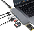 Silver 8-in-1 USB-C hub for MacBook Pro with dual connectors and multiple ports