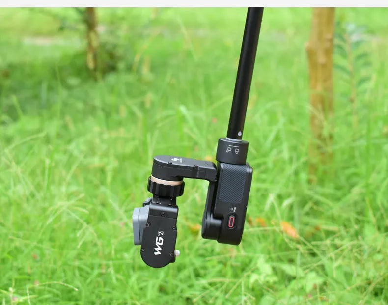 Black retractable aluminium selfie stick fully extended to 180cm with a smartphone attached.