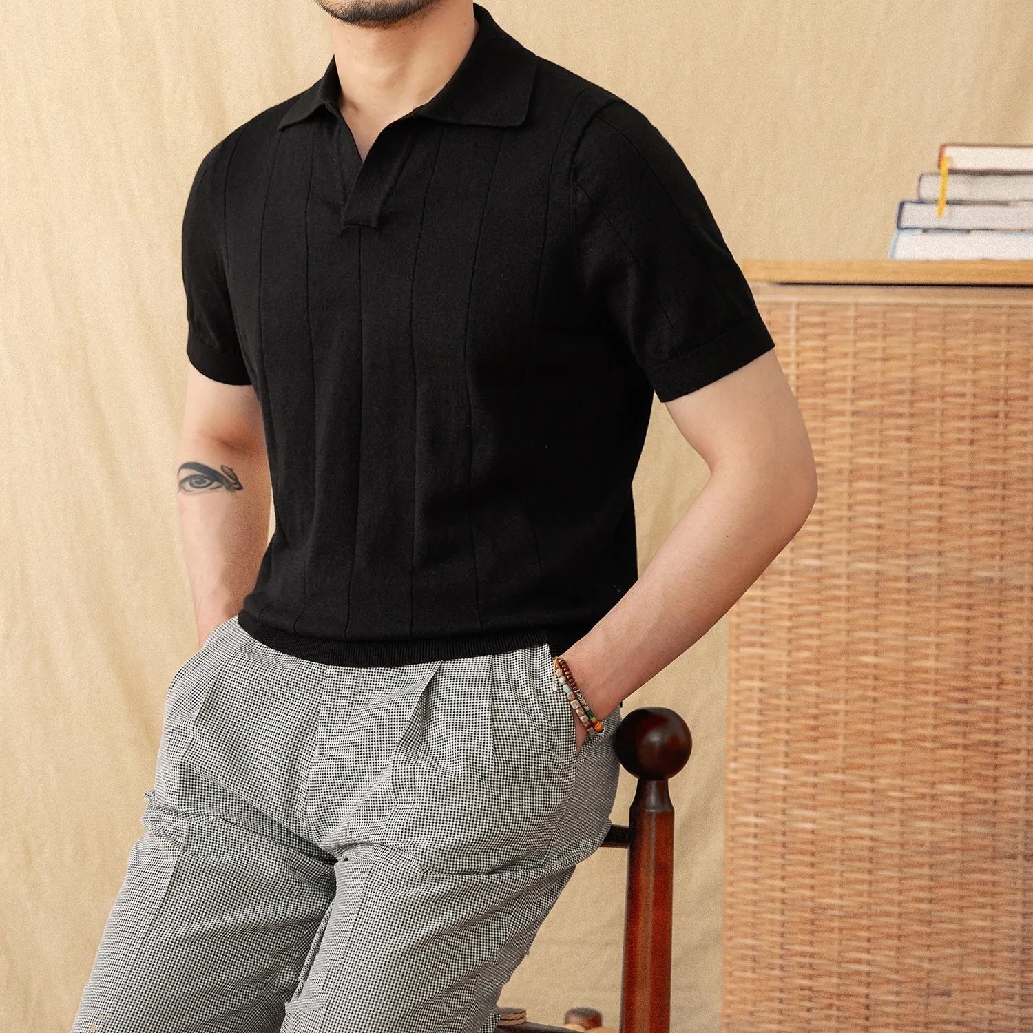 Men's purple short sleeve polo shirt with seagull collar and sunken stripe knit texture.