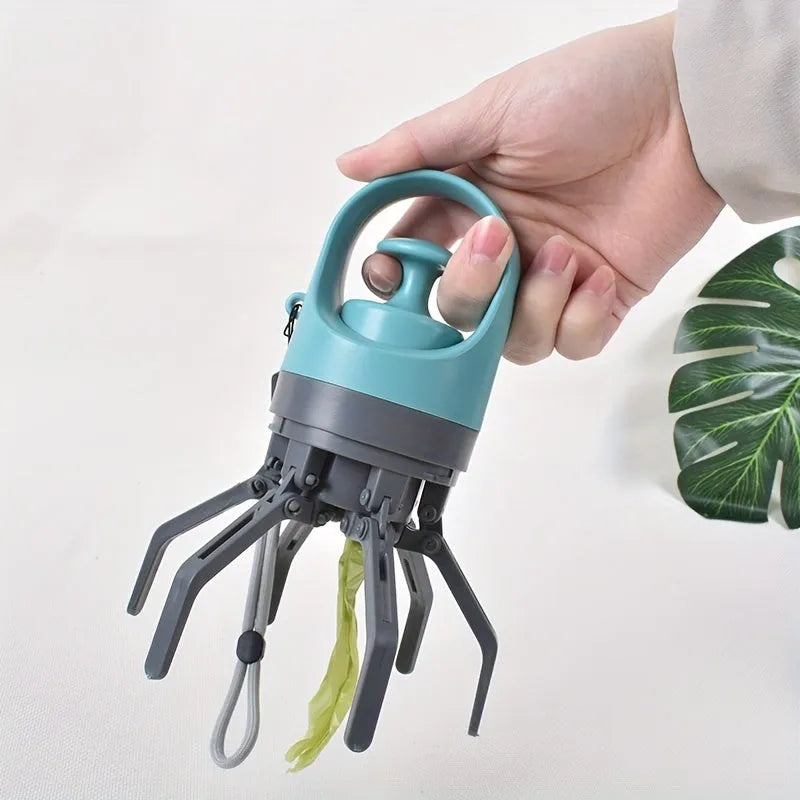 Blue portable dog poop scooper with built-in bag dispenser, clipped to a dog leash