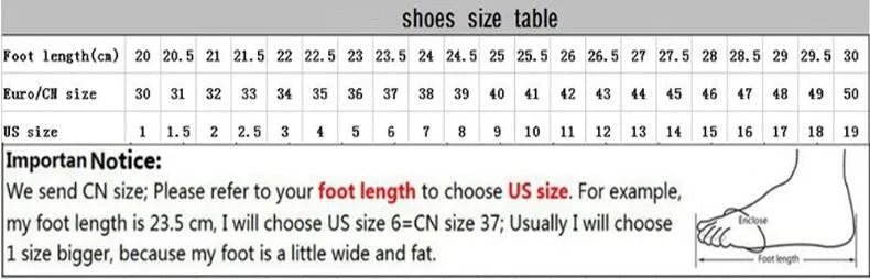 Women's leather sports casual shoes with thick sole and lace-up front in black and white colour.