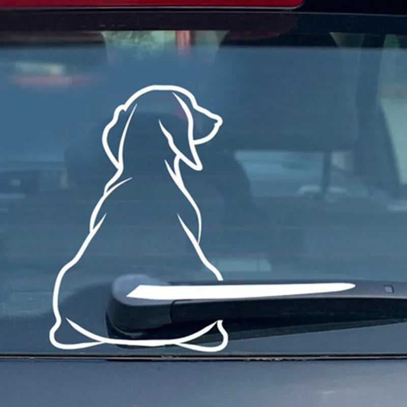 Cartoon dog car window sticker with rear wiper design and wagging tail on vehicle glass