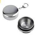 Silver stainless steel collapsible travel cup folded small on a key ring for outdoor use