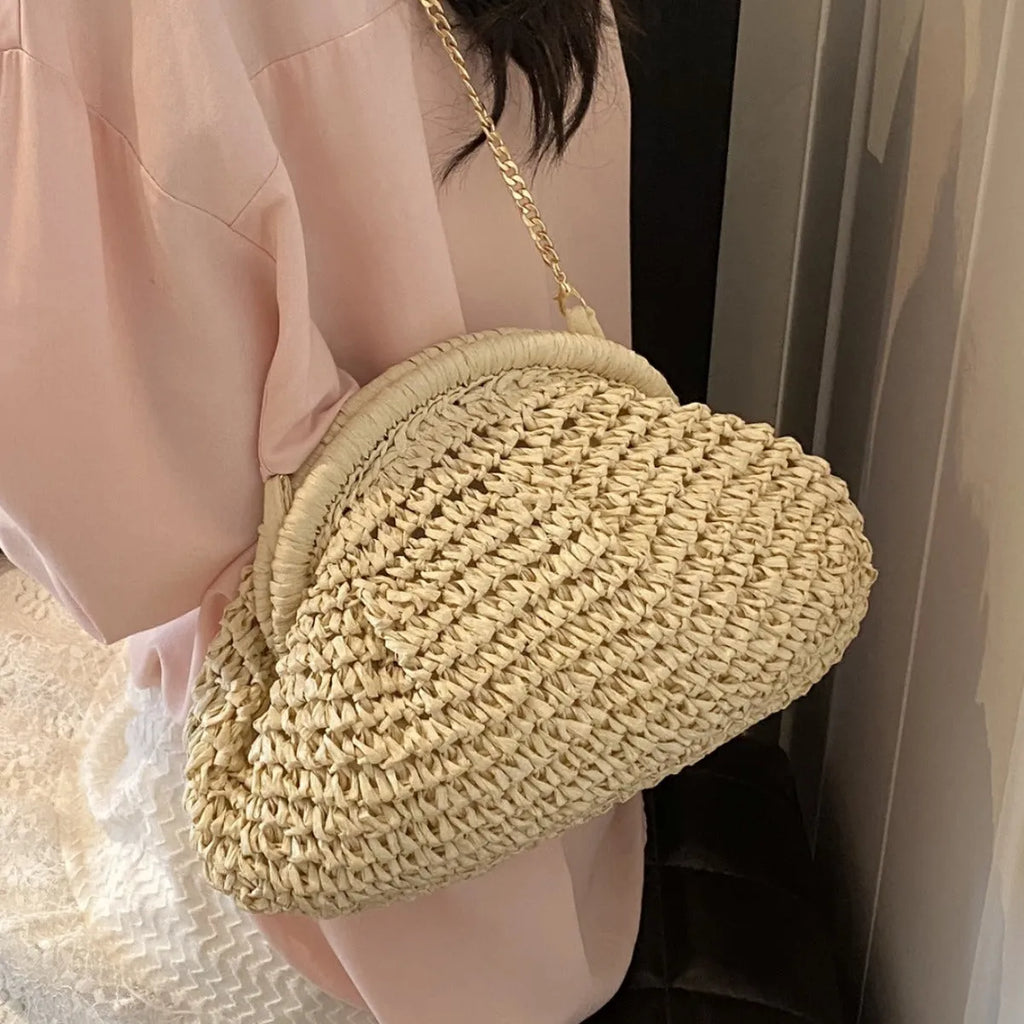 Khaki straw beach handbag with chain detail and crossbody shoulder strap