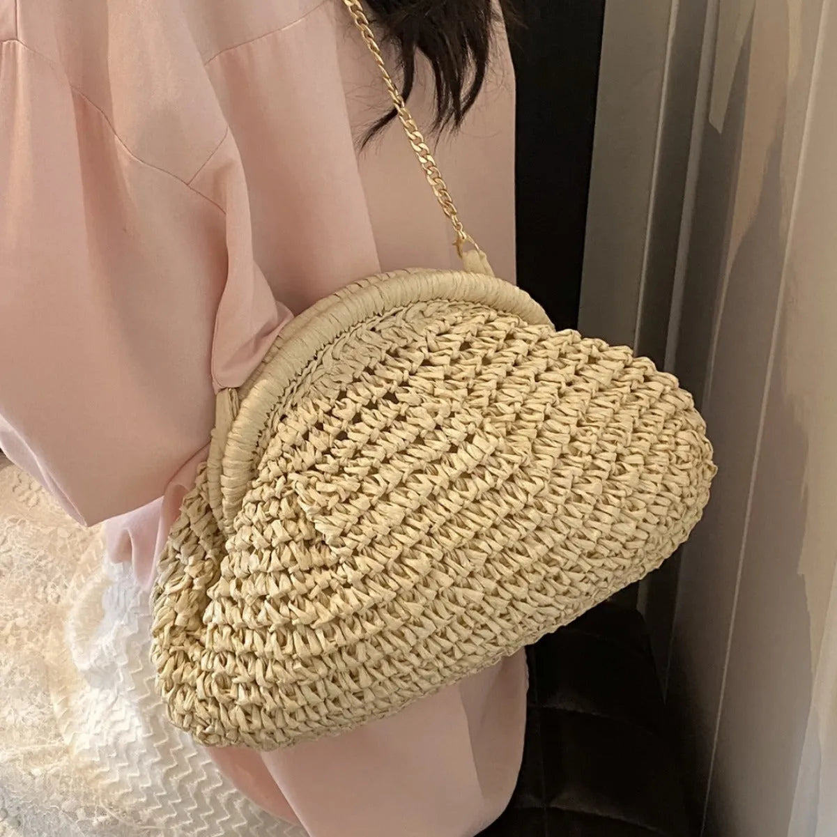 Khaki straw beach handbag with chain detail and crossbody shoulder strap