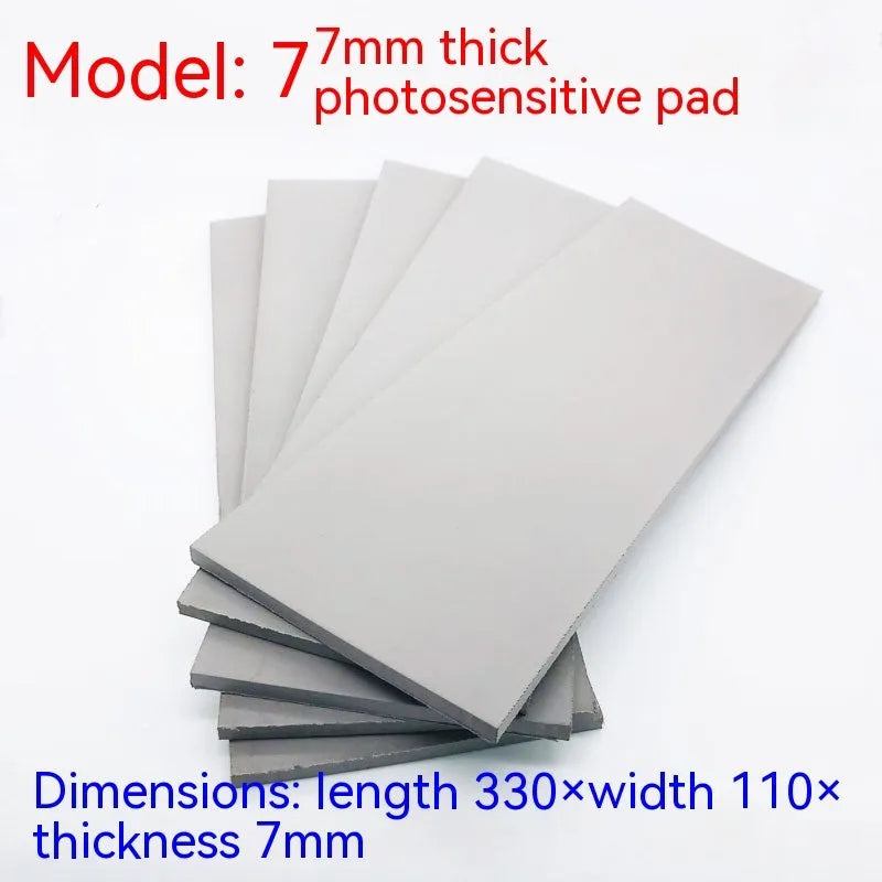 Black and grey plastic light-sensitive mat for photosensitive seal making measuring 330x110mm