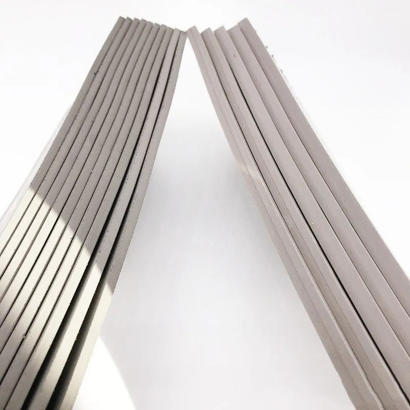 Black and grey plastic light-sensitive mat for photosensitive seal making measuring 330x110mm