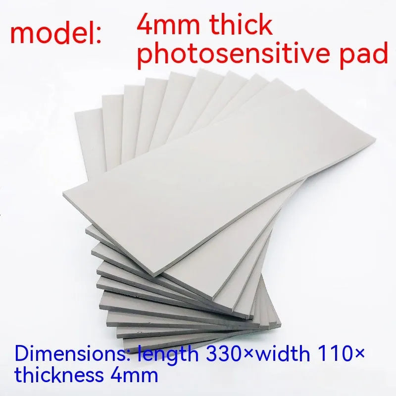 Black and grey plastic light-sensitive mat for photosensitive seal making measuring 330x110mm
