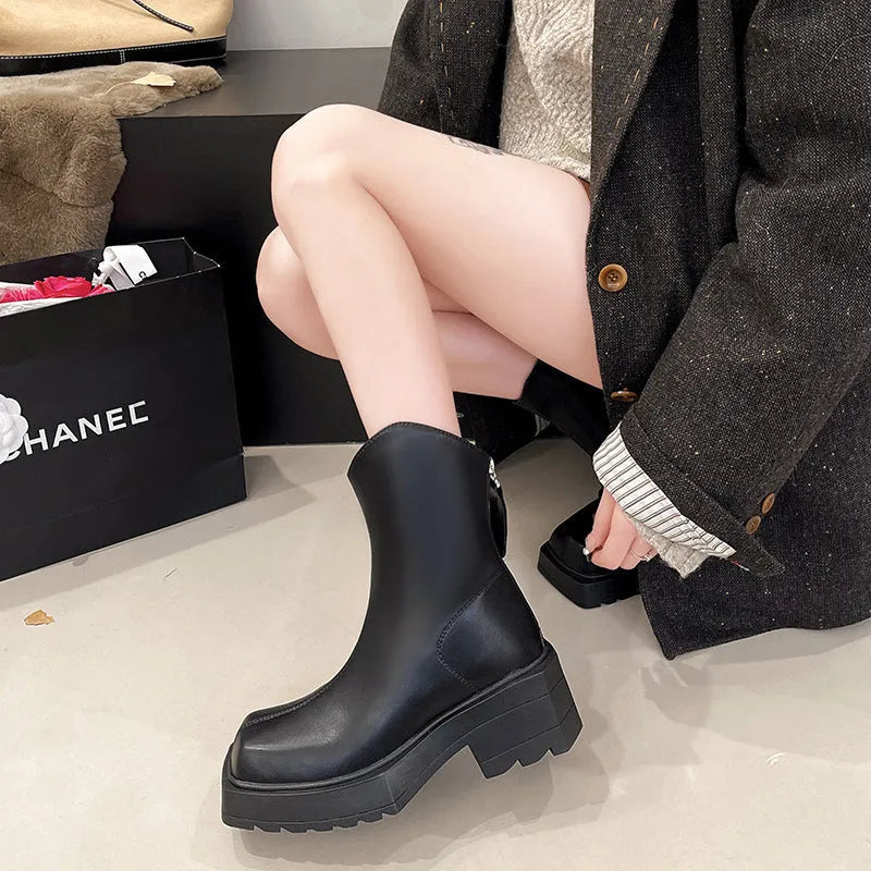 Black platform Martin boots for women with a square toe, back zipper, and a high heel.