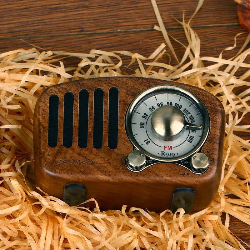 Retro wooden wireless mini speaker showing wood grain texture and compact size