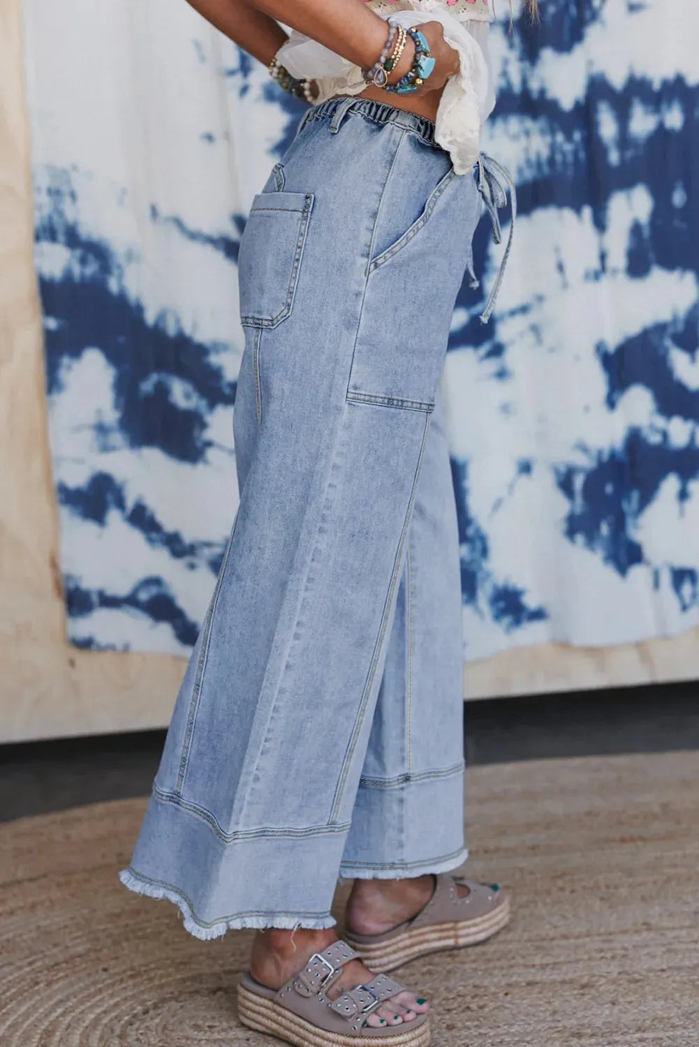Beau blue women's wide leg denim trousers with drawstring waist and raw hem detail