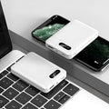 Large capacity portable power bank in black or white with multiple USB charging ports