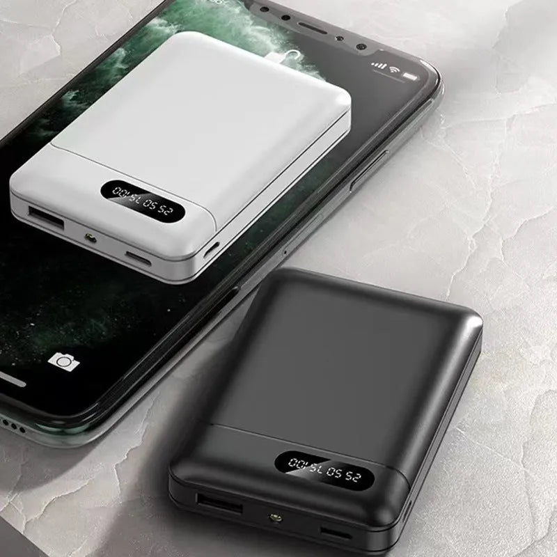 Large capacity portable power bank in black or white with multiple USB charging ports
