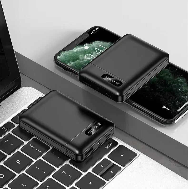 Large capacity portable power bank in black or white with multiple USB charging ports