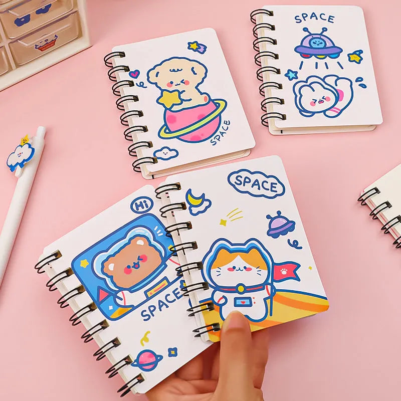 Astronaut-themed pocket flipper notebook showing compact 10.5 by 8 cm dimensions with space character cover options