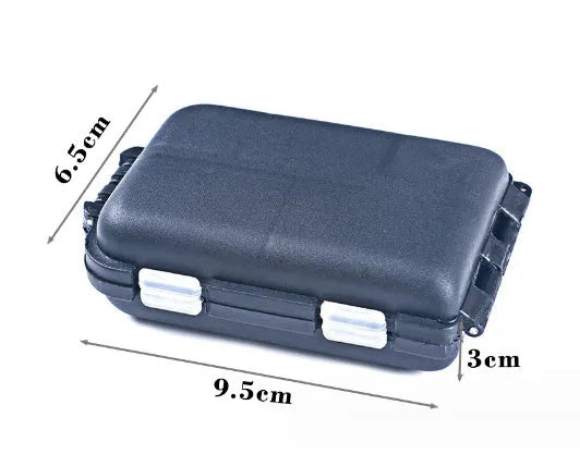 Small black plastic fishing tackle box with 10 internal compartments, shown next to fishing hooks.