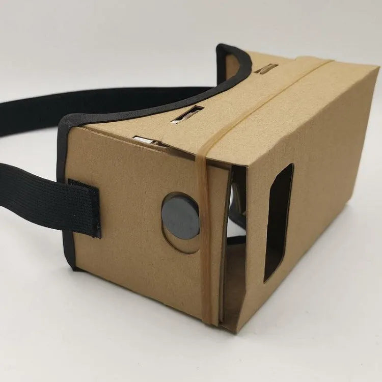 Foldable pink and white cardboard VR glasses headset with lenses and rubber head strap for smartphones.